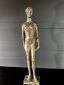 Hanne Varming: "Kristine". Figur af gyldenbrunt patineret bronze. Sign. HV 1/20. H. 43.